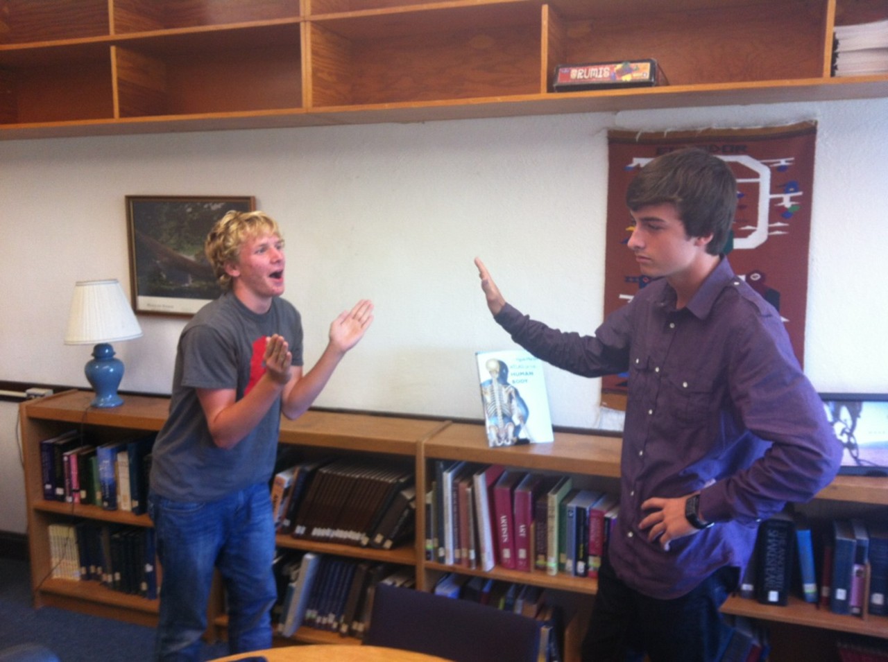 Two people demonstrate "Talk to the Hand"
