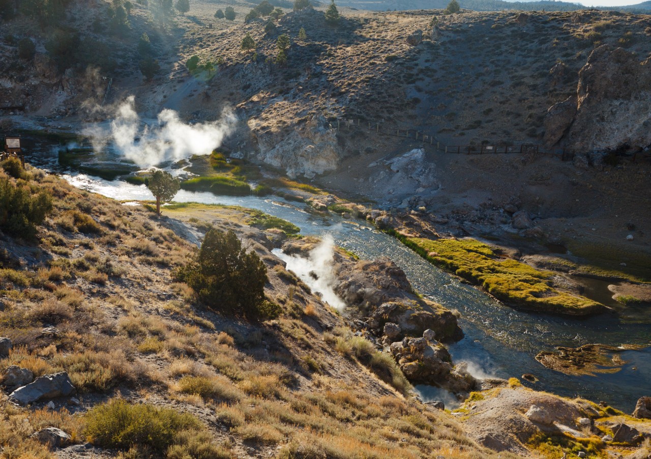 Steam from geothermal springs rise out of Hot Creek