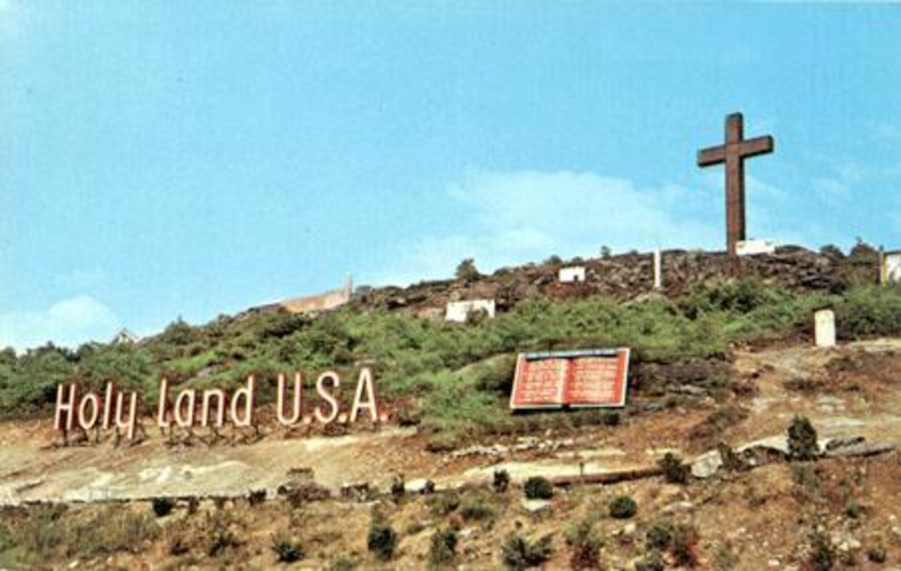 Postcard of the sign and cross at Holy Land USA
