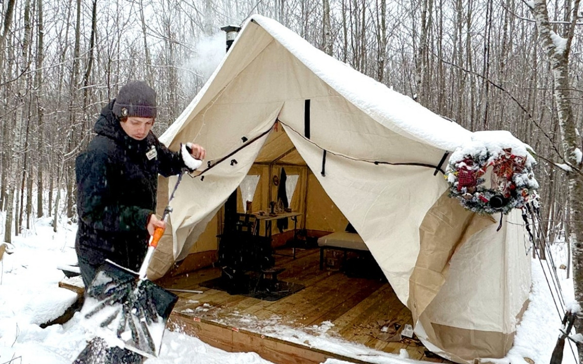 Winter Camping in a Hot Tent During the First Snowfall