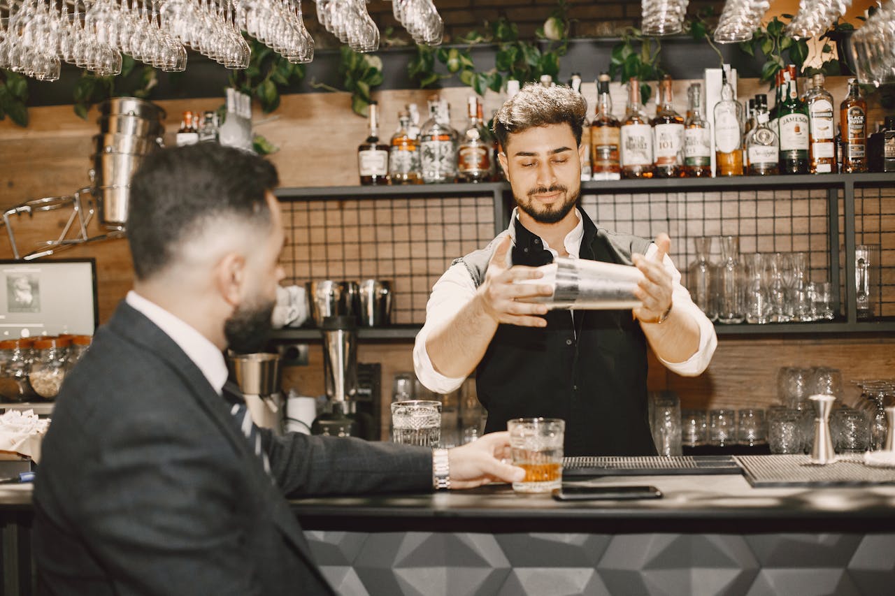 A Bartender Preparing a Drink
