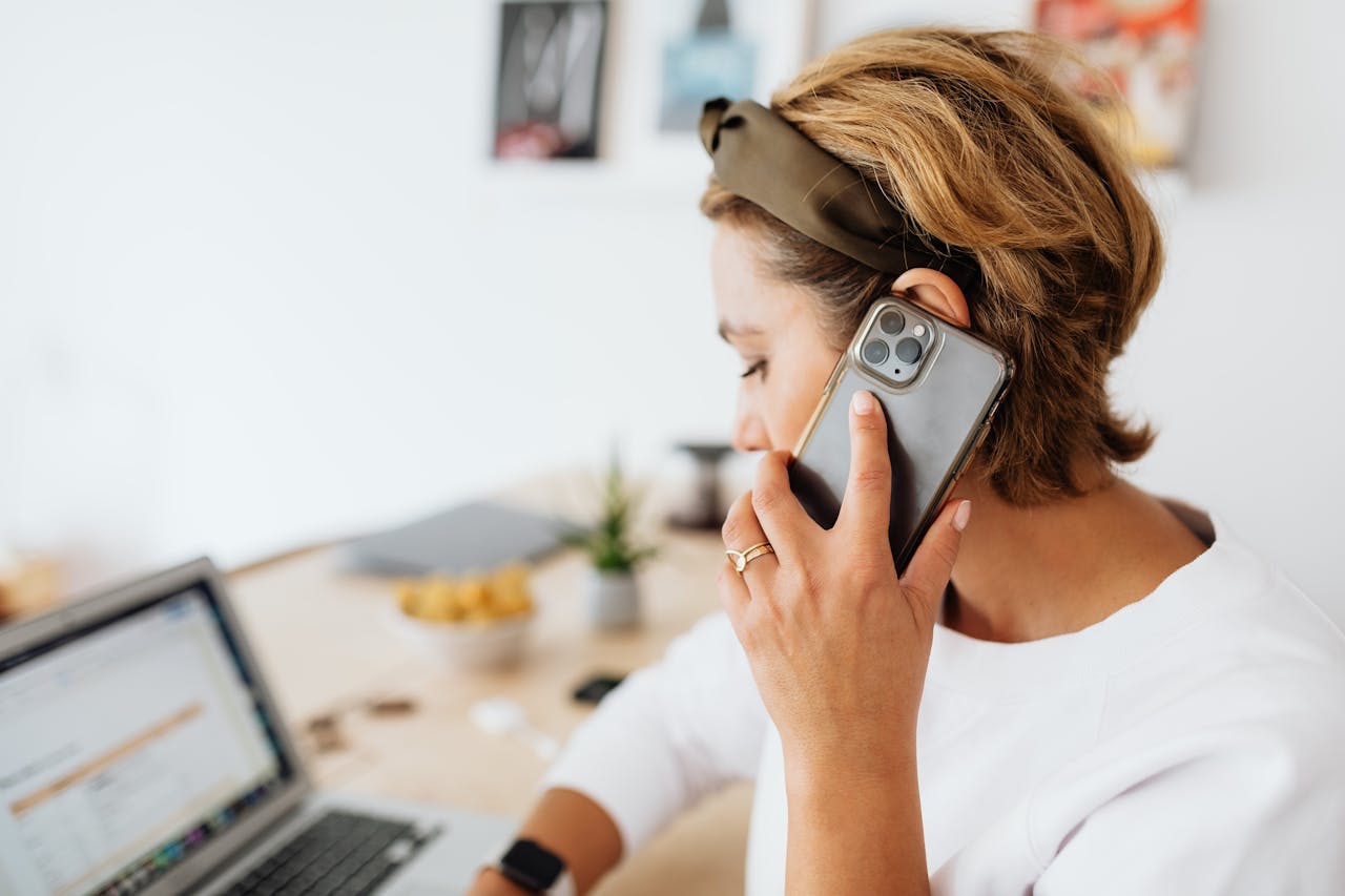 Woman Speaking on Phone 
