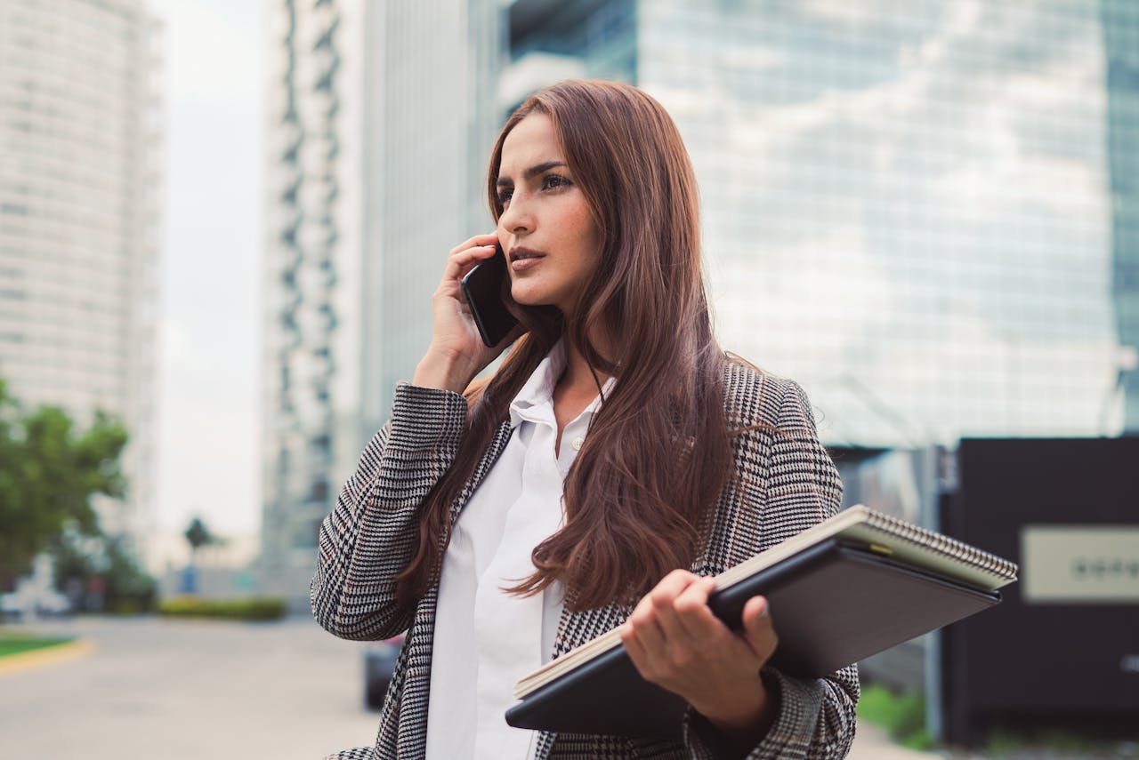 Portrait of Woman in Coat Talking on Phone