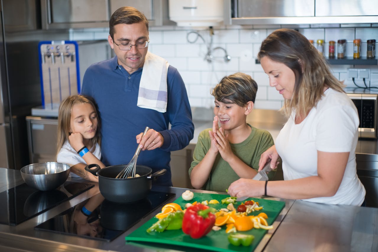 A Family Preparing Food in the Kitchen