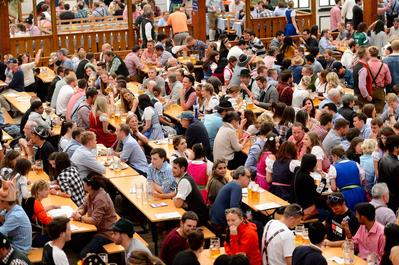 Historic tavern interior with crowded holiday drinkers.