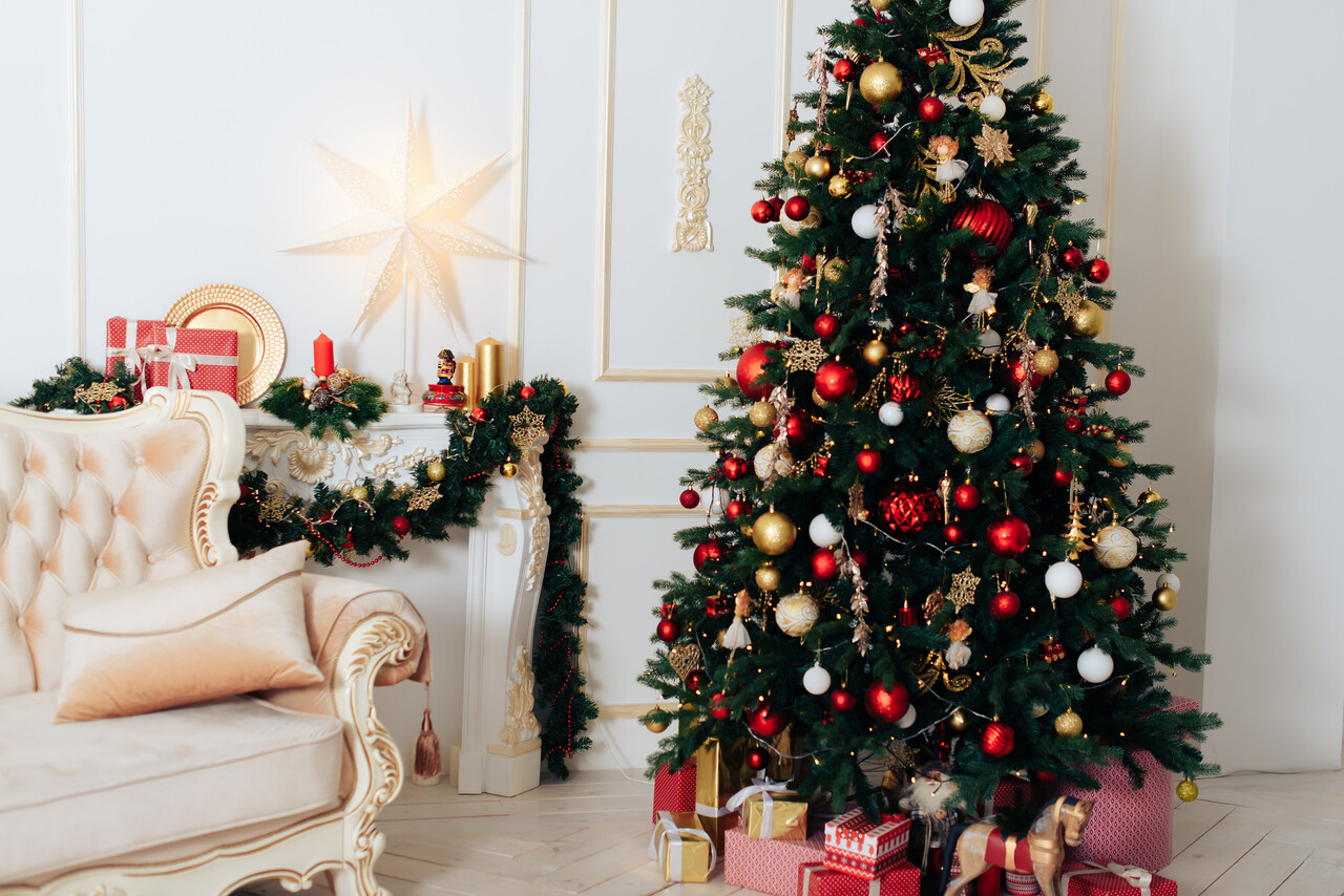 A cozy indoor Christmas tree with European-style ornaments.