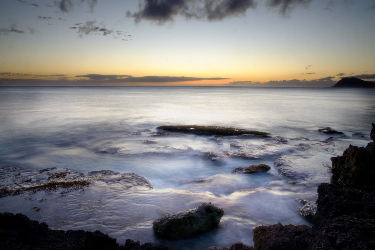 A peaceful coastal or upland landscape at sunrise or sunset on Hawaii Island,