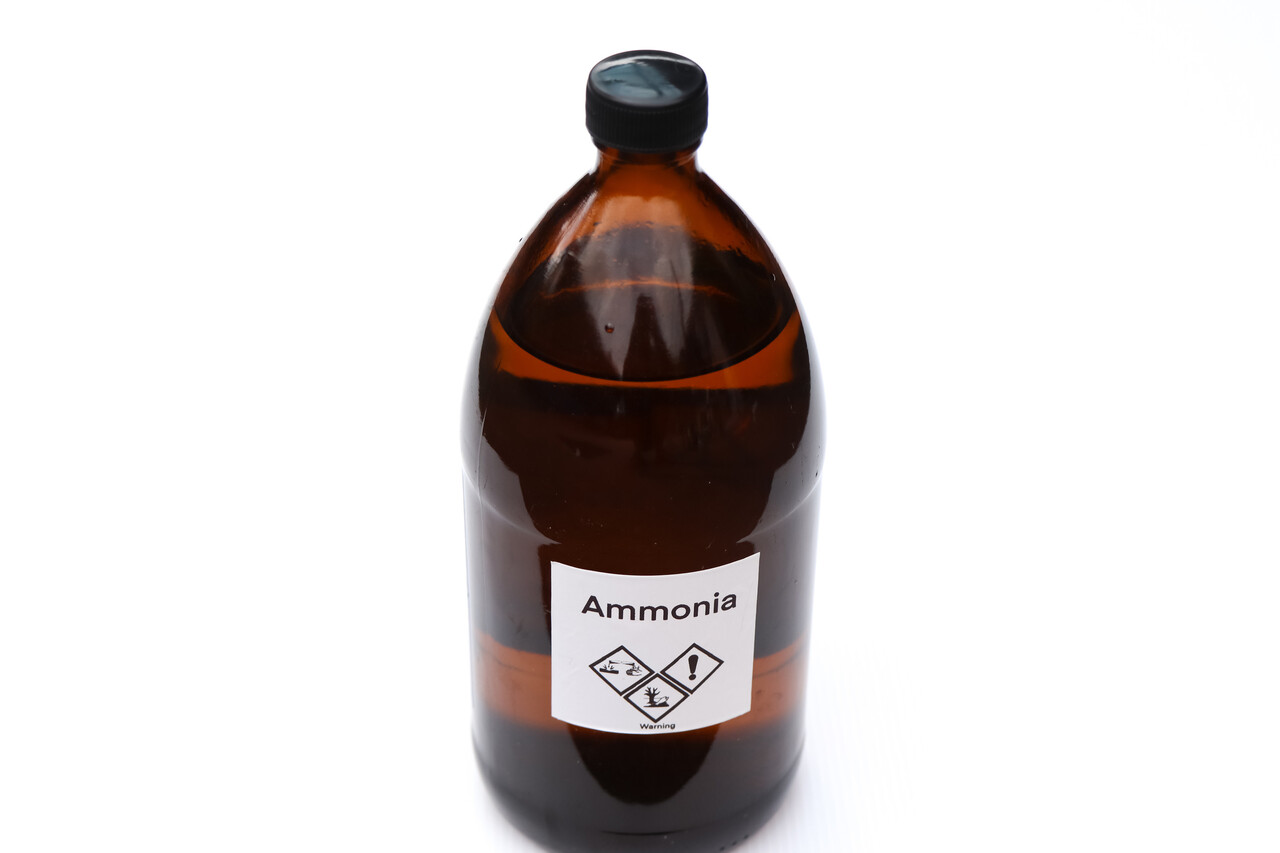 Ammonia in bottle, chemical in the laboratory and industry