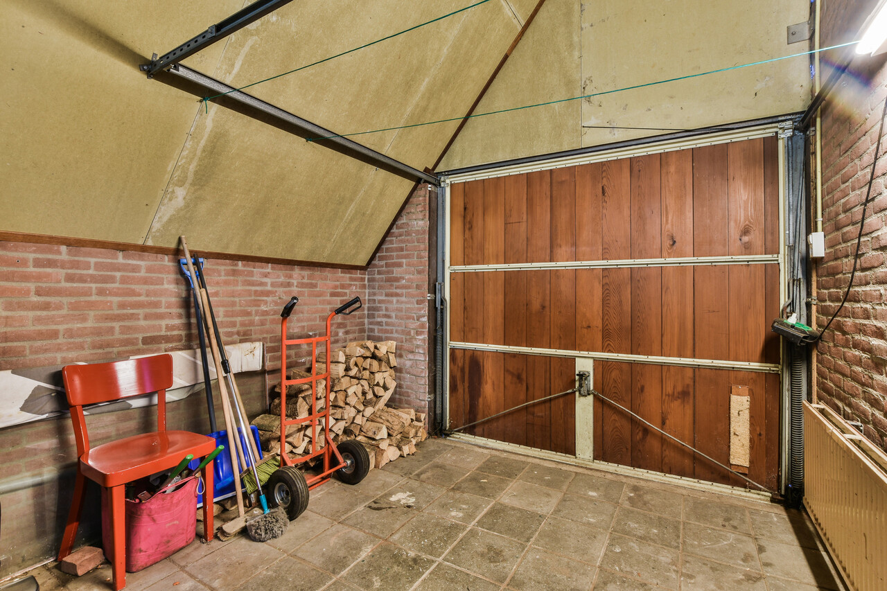 A garage mid-conversion with insulation visible.