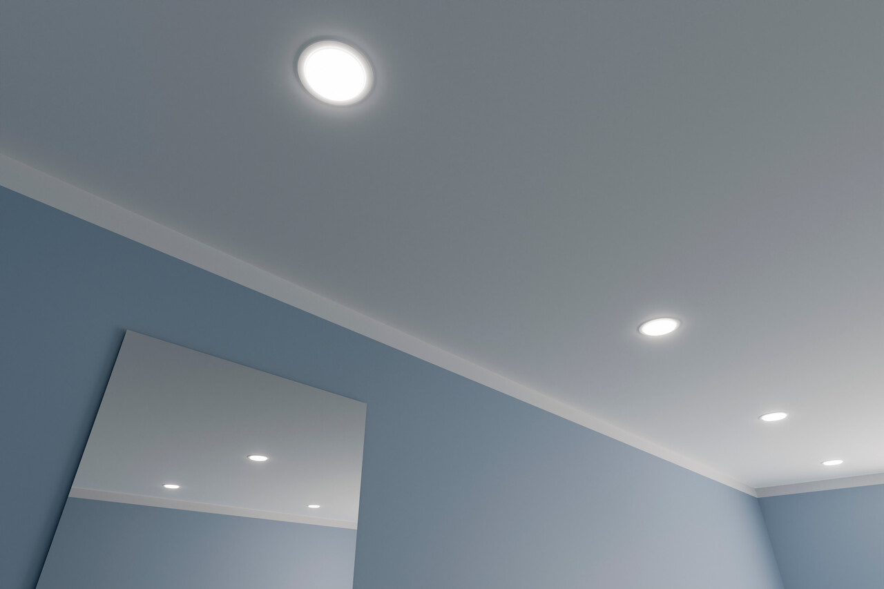 Cutouts for recessed lights in drywall.