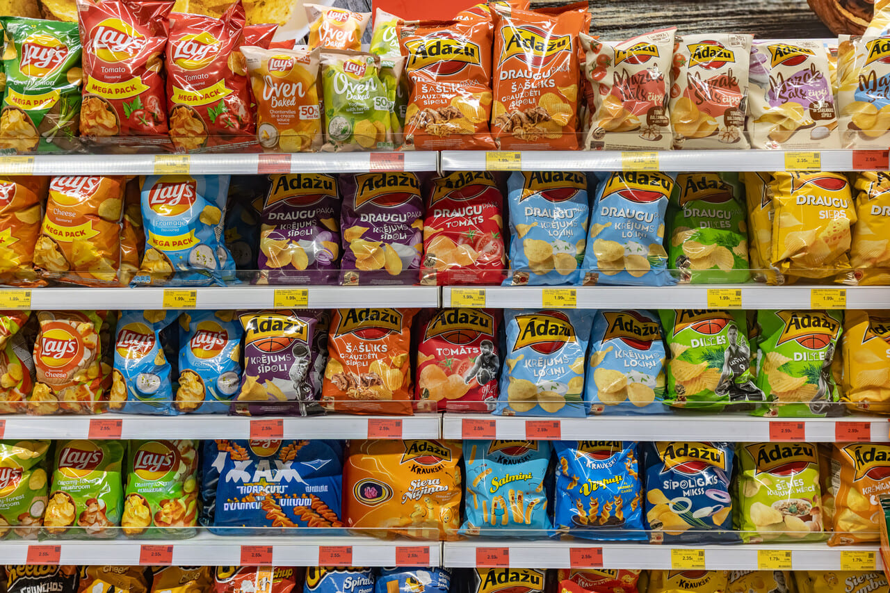 A shelf of imported snacks in an international grocery aisle.