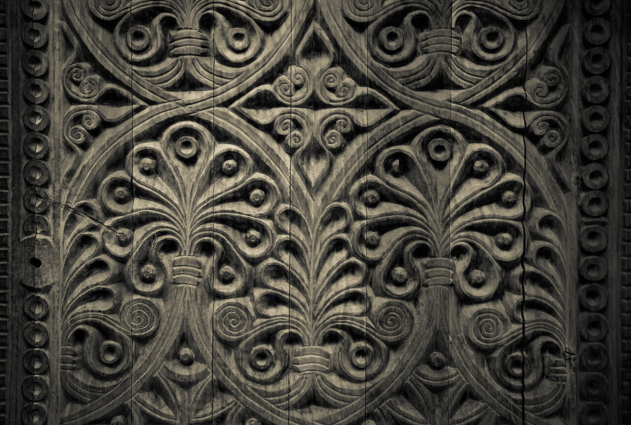 Dark wallpaper, carved wood