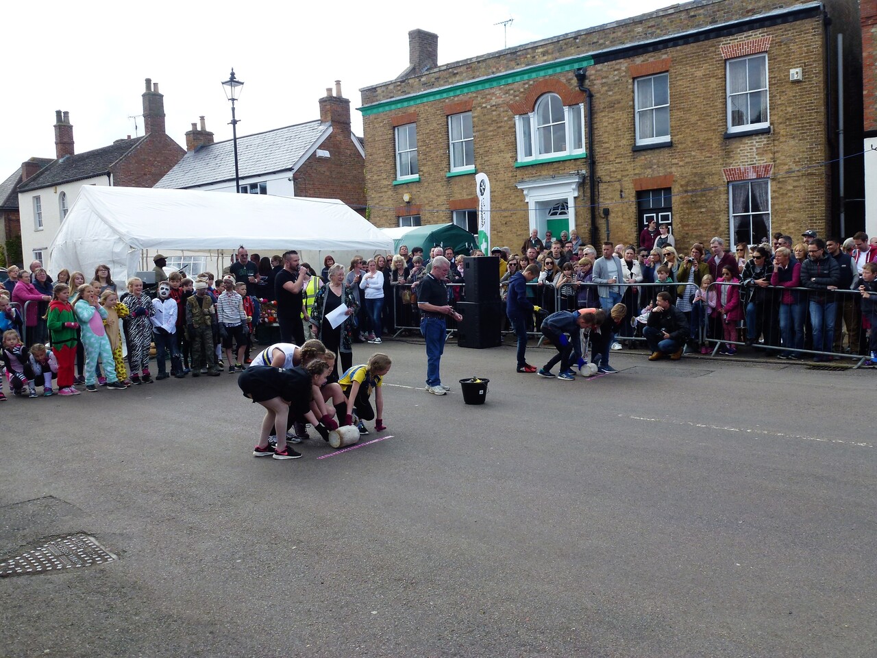 A historic engraving or sketch showing spectators at a strange or outdated public event.