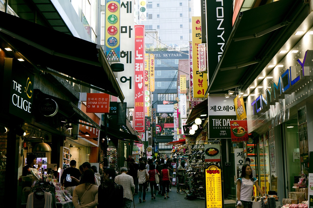 A street showing older storefronts next to newer ones,