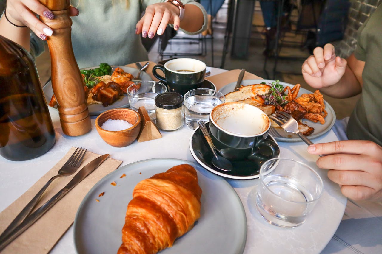 A guest arranging personal items neatly on the table in restaurant