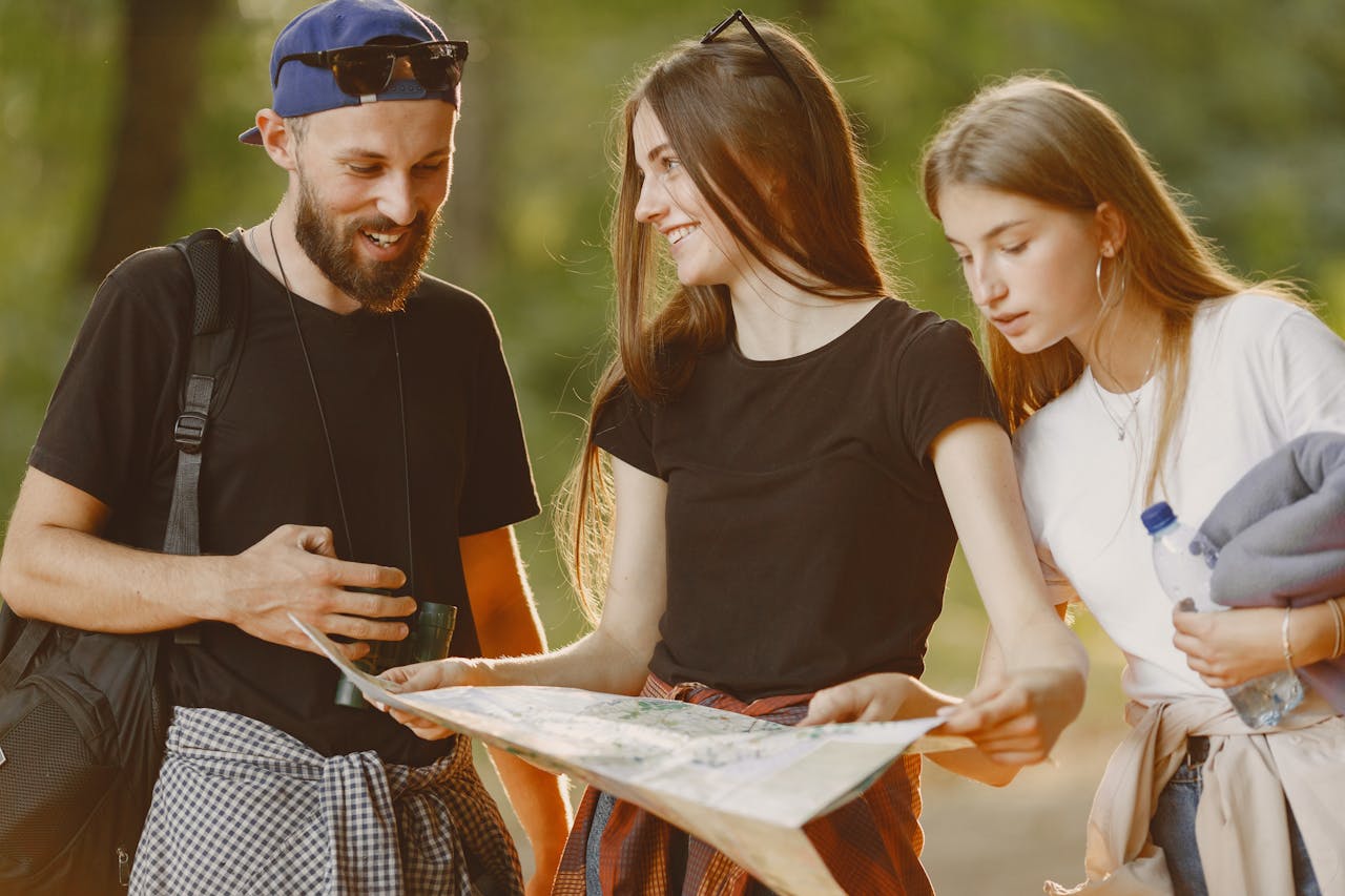 Traveler holding a map, looking at cost-efficient paths.