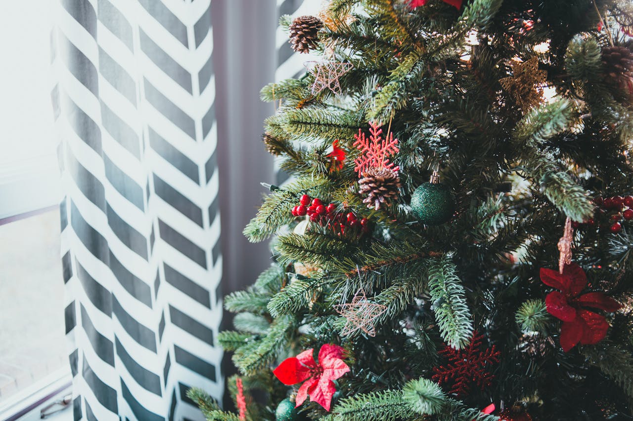 A Christmas tree positioned too close to a heater or curtain, clearly showing the proximity risk.