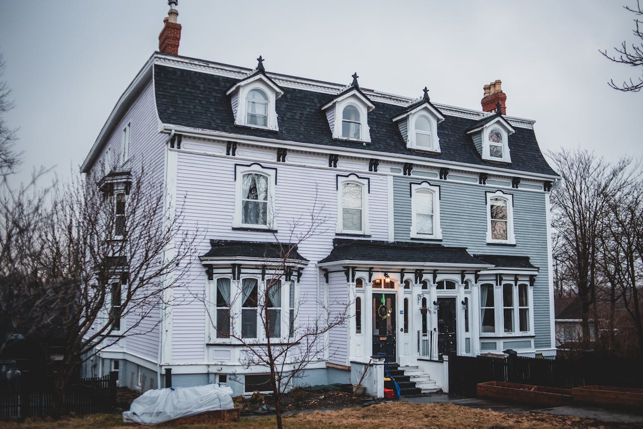 A restored historic home with traditional windows and siding.
