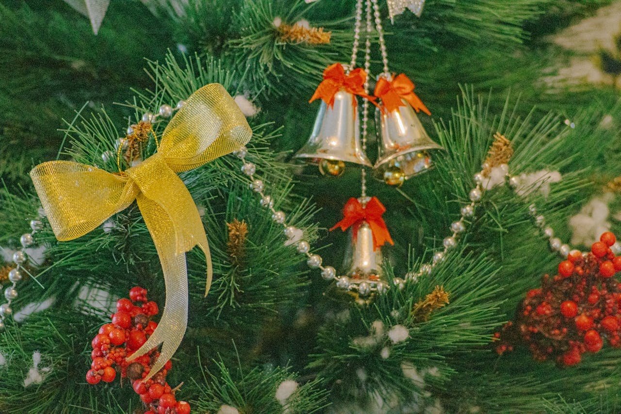 An artificial tree section laid out on the floor, showing prelit wiring up close.