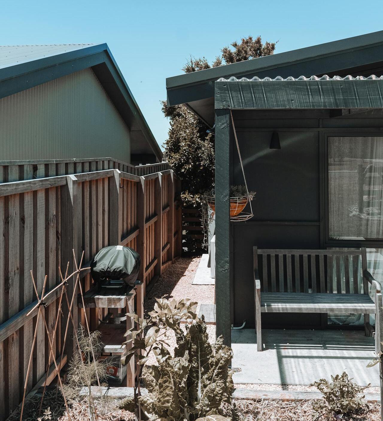 A backyard fence showing clear height differences.