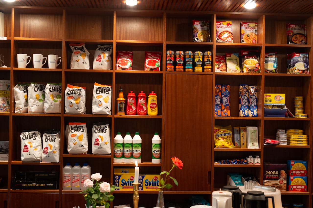 A close, well-lit shot of assorted everyday American products -packaged snacks,