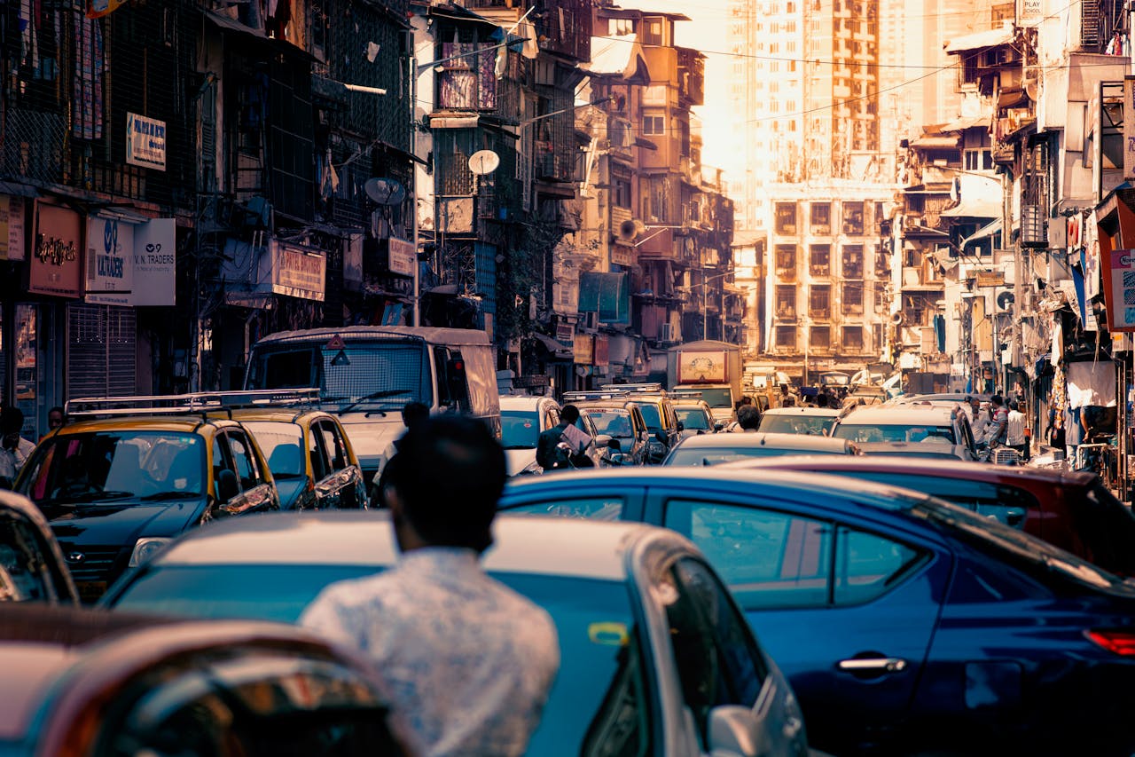 A street market road with layered traffic noise.