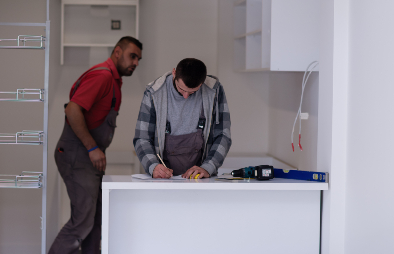An unfinished kitchenette installation awaiting approval.
