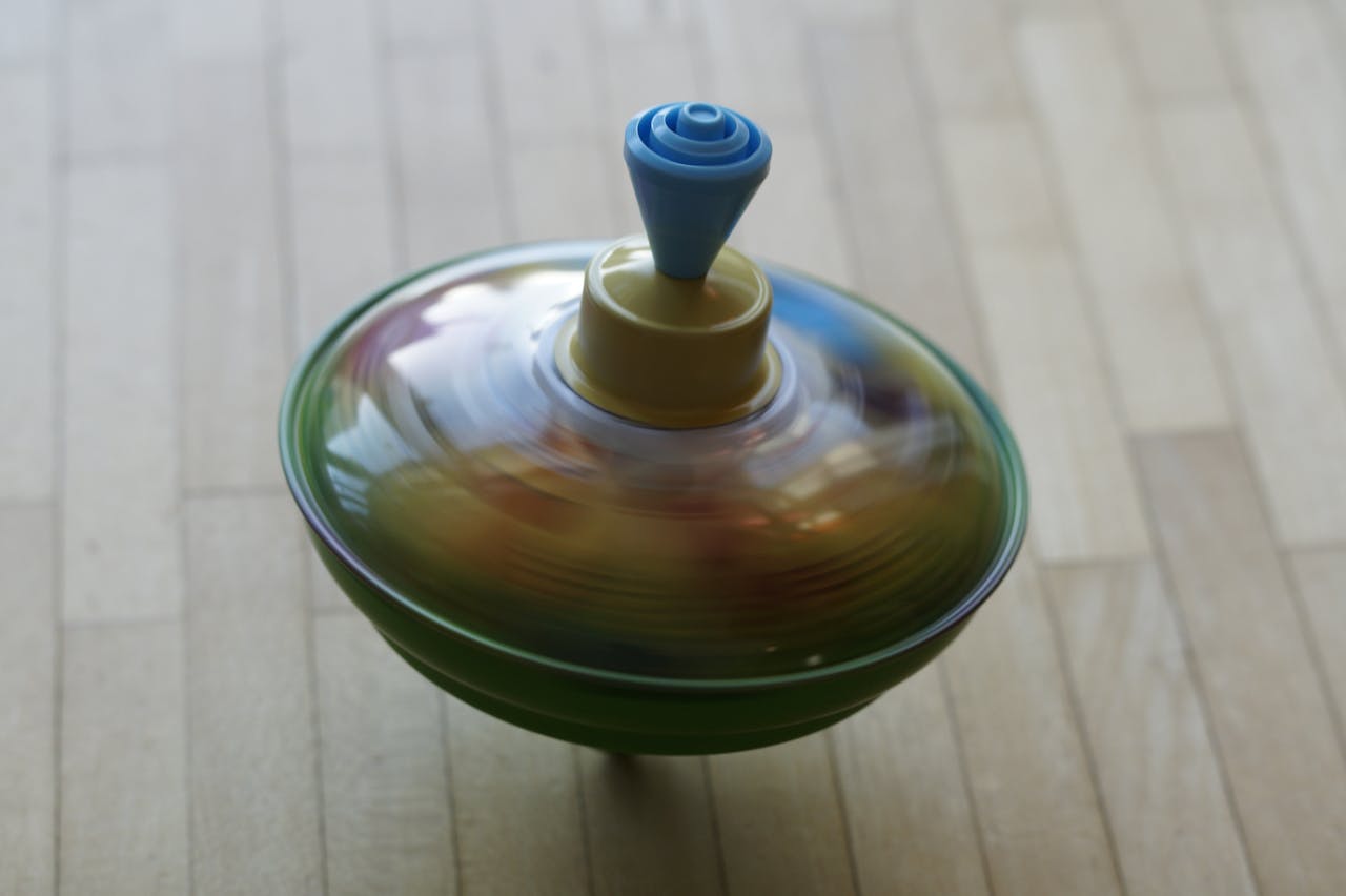 Spinning Tops and Beyblade Precursors