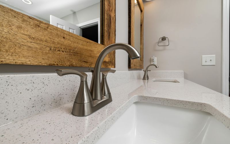 Bathroom with brushed brass fixtures and hardware