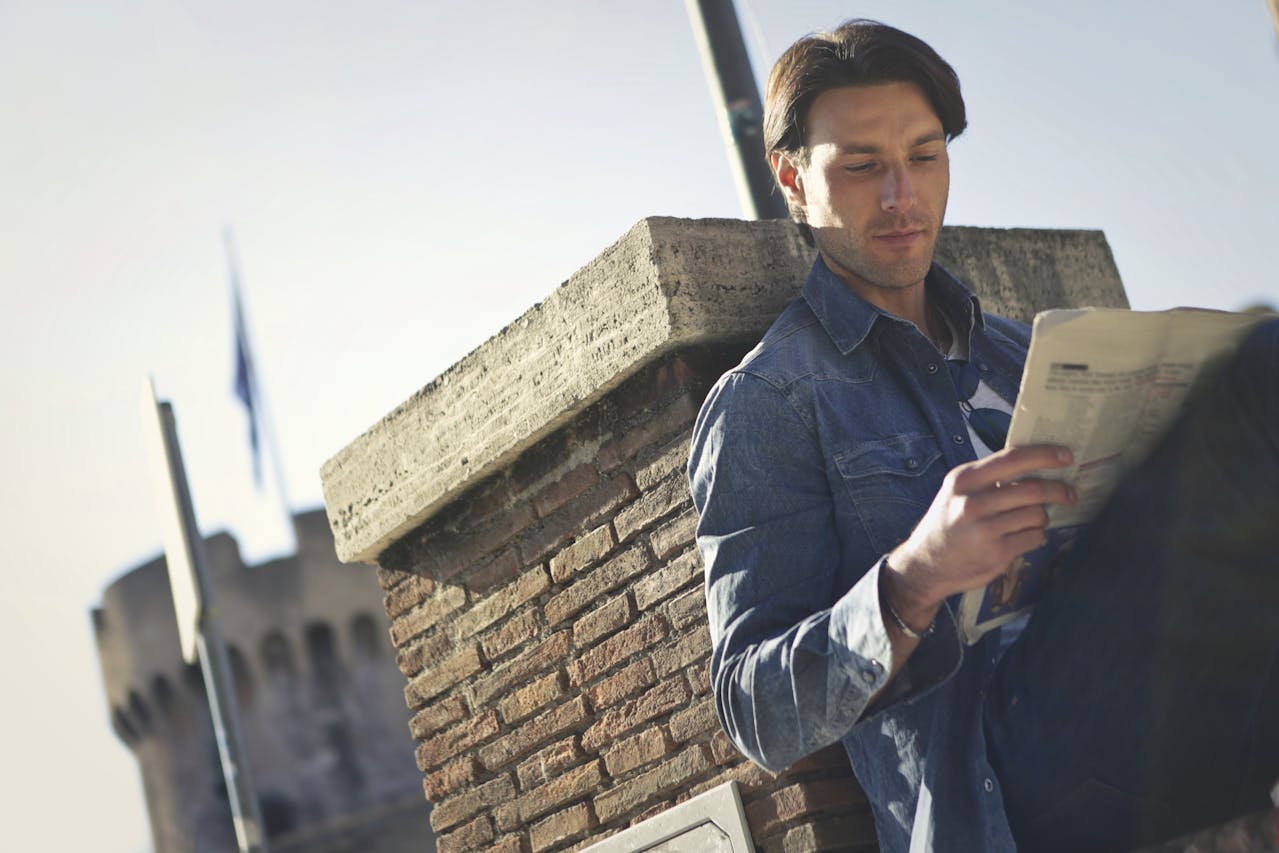 Tourist reading a Canadian cannabis or alcohol sign, illustrating legal differences from the U.S.