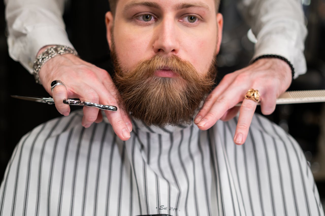 Various face shapes and hair types displayed with scissors for styling guidance