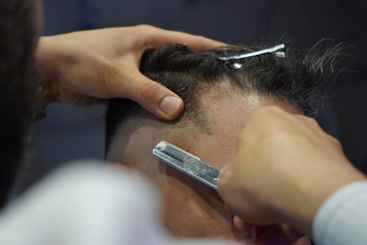Hair neatly sectioned with clips ready for a precise haircut