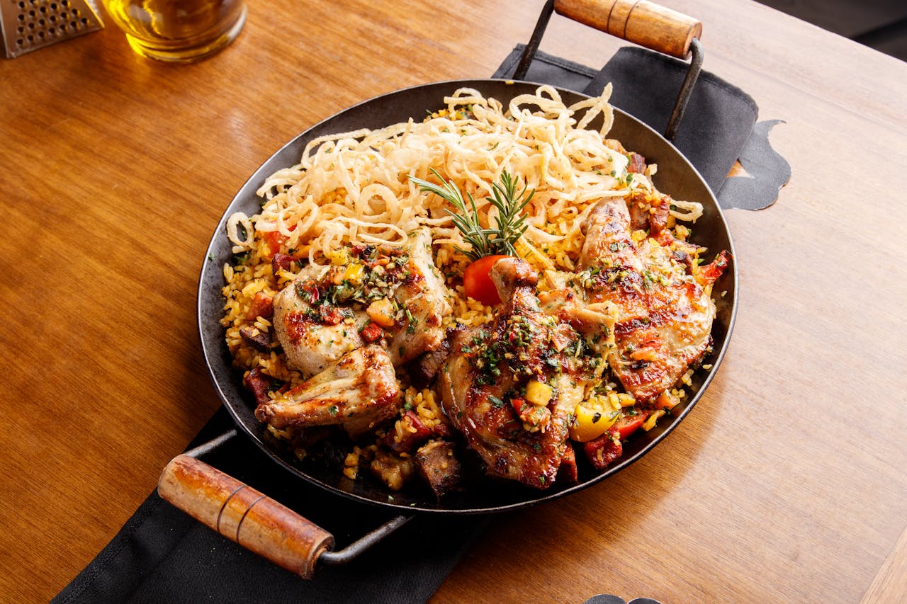 Sheet pan with vegetables and chicken roasting for easy one-pan meals.