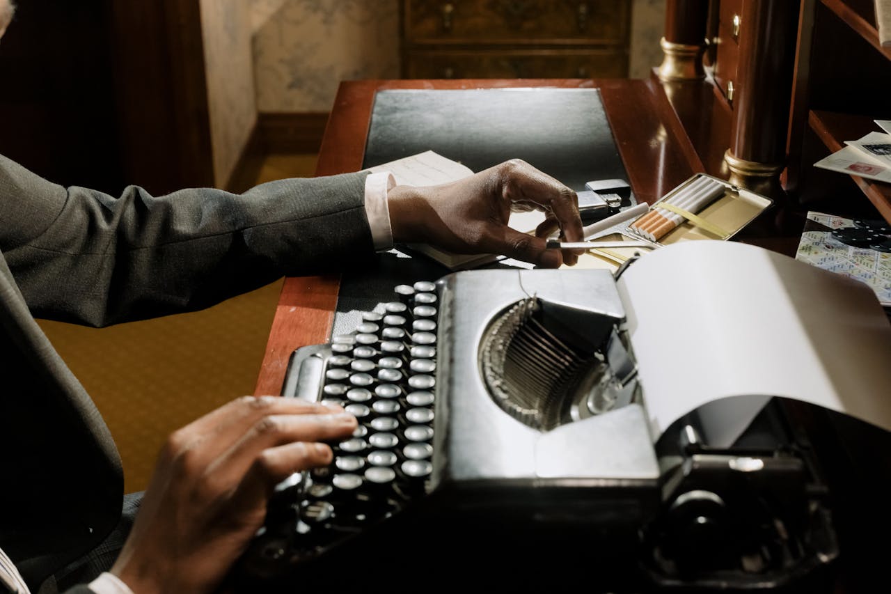 Office desks with ashtrays and smoke in the background.
