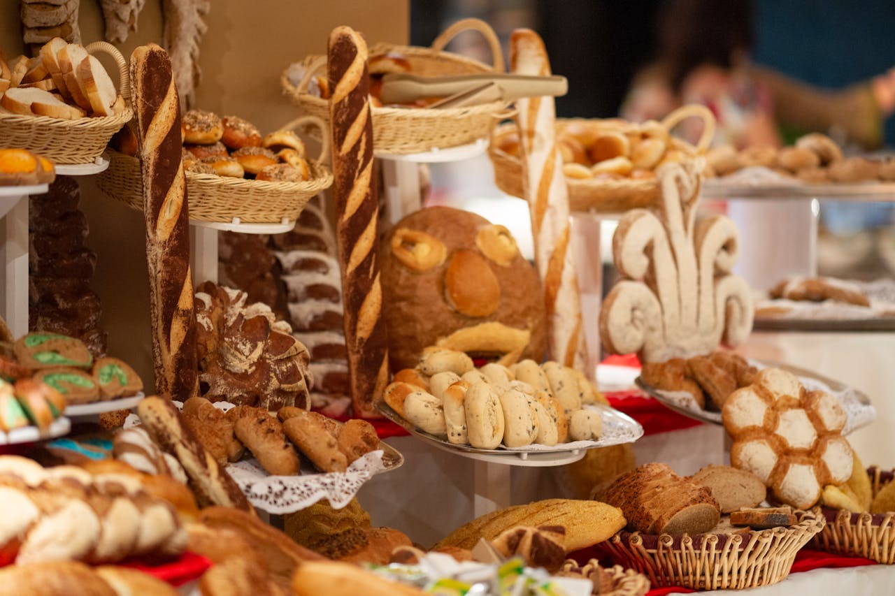 Artisan-labeled breads and cheeses at a restaurant or bakery display.