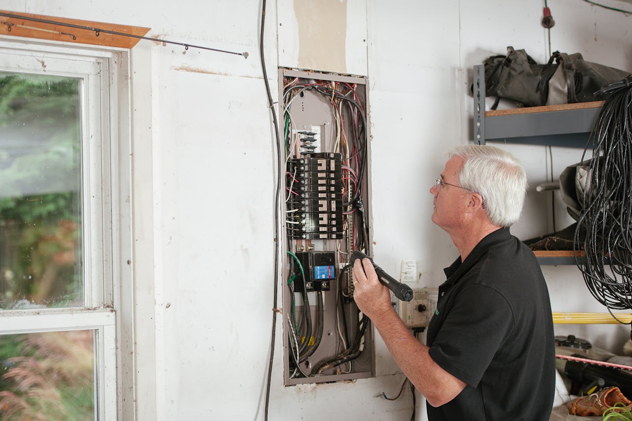 Home breaker panel and wiring, illustrating potential overheating causing fishy odors.