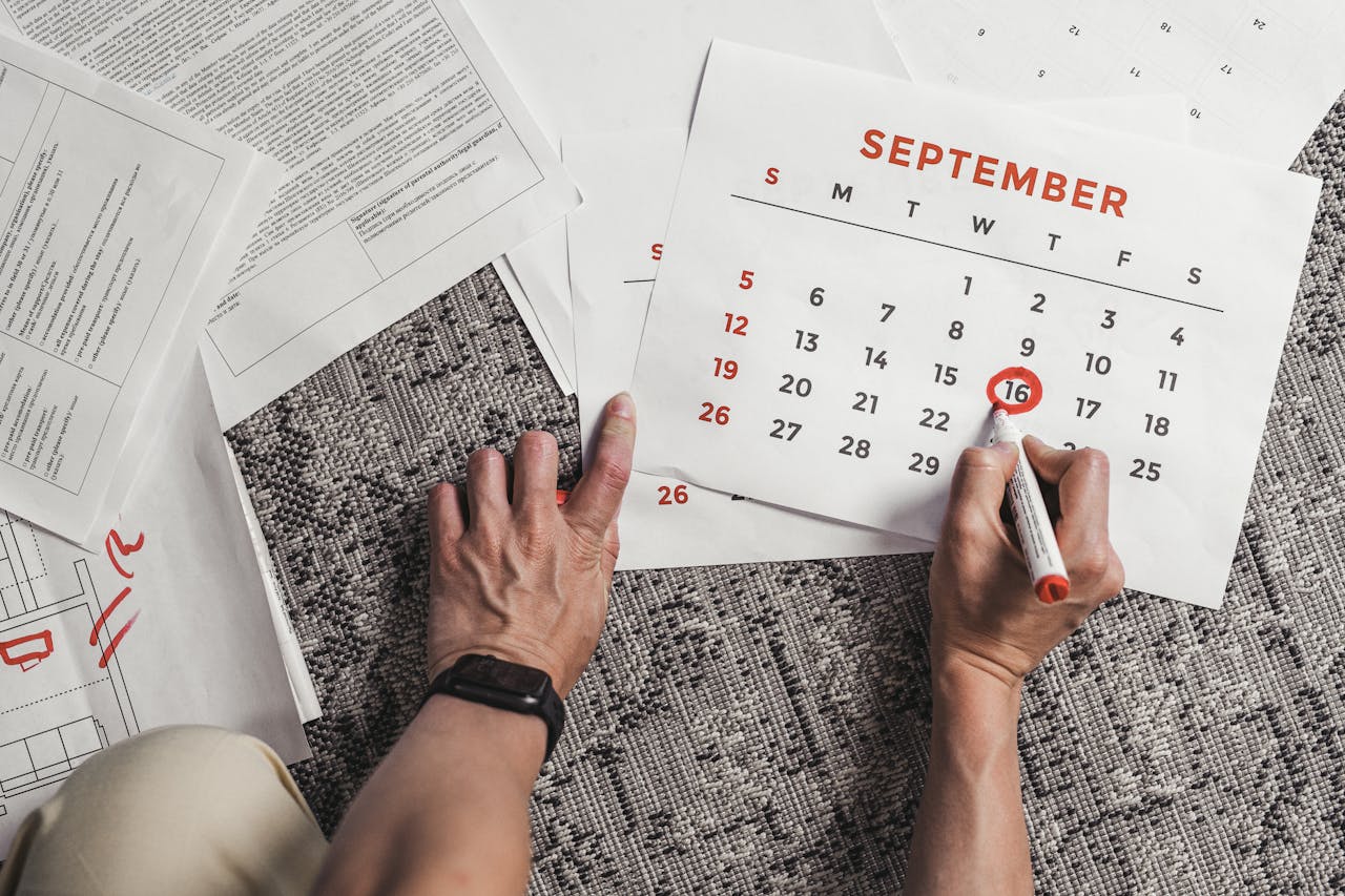 A calendar with overlapping schedule markings, representing the confusion over “biweekly” and the importance of specifying frequency.