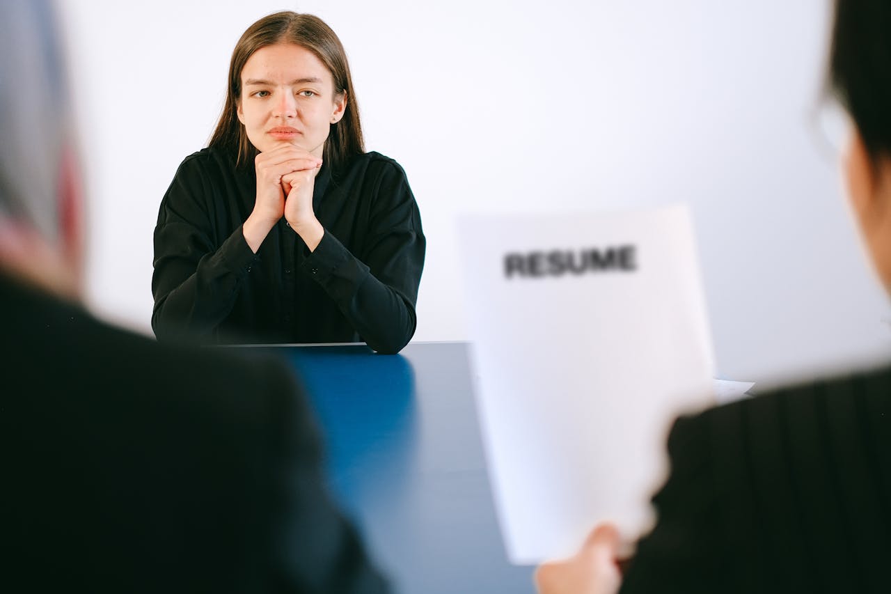 Candidate leaning back slouched in their chair, shoulders rounded, giving an impression of disengagement.