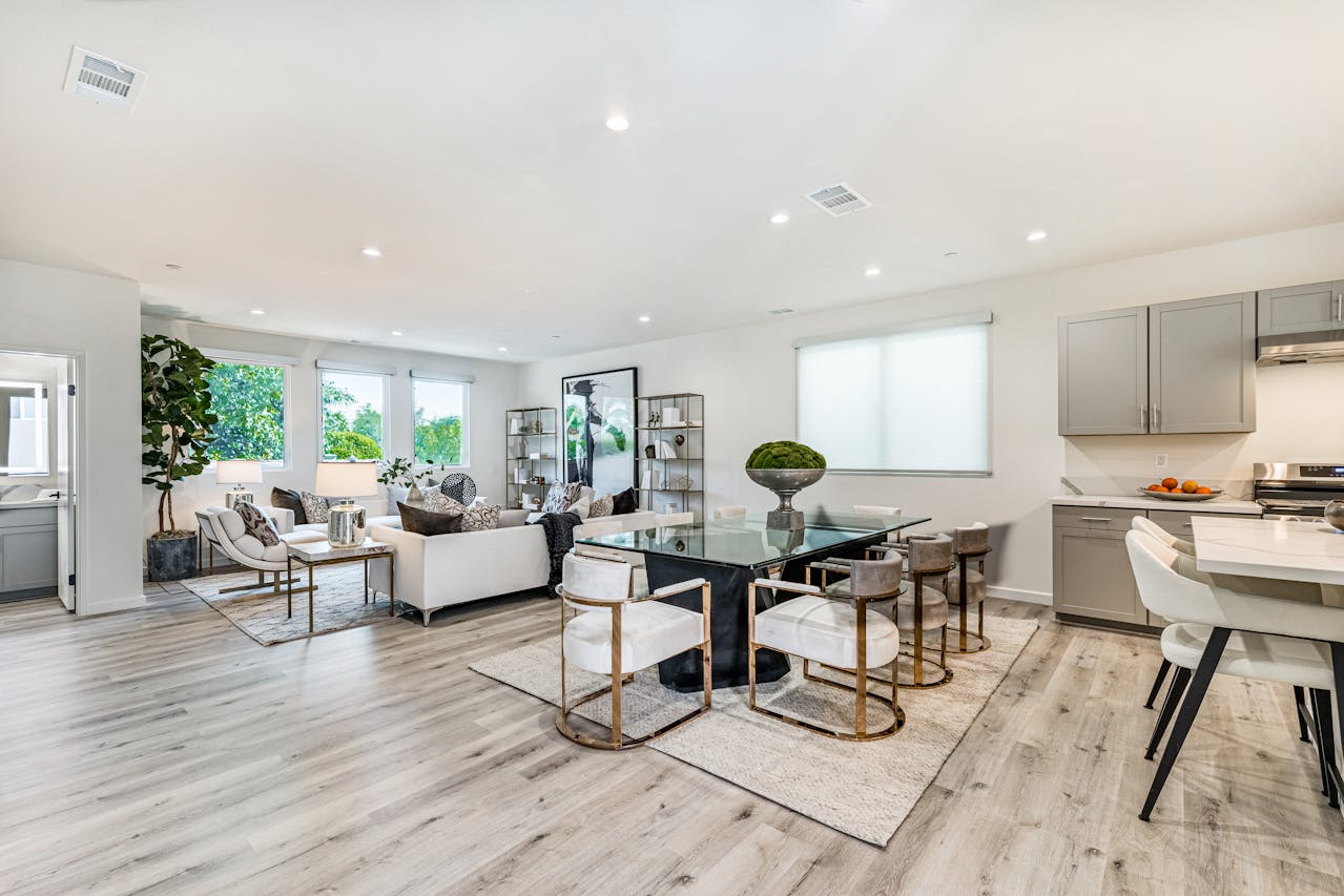 Living room with a mix of functional furniture, books, and decor showing practical clutter