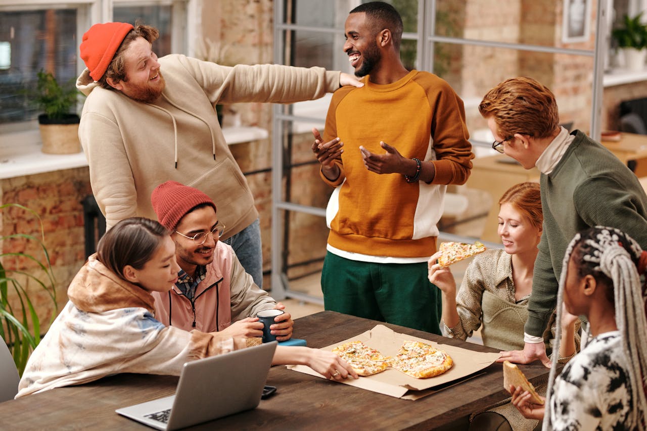 Group of neighbors talking and laughing on a street corner, showing lively expressions