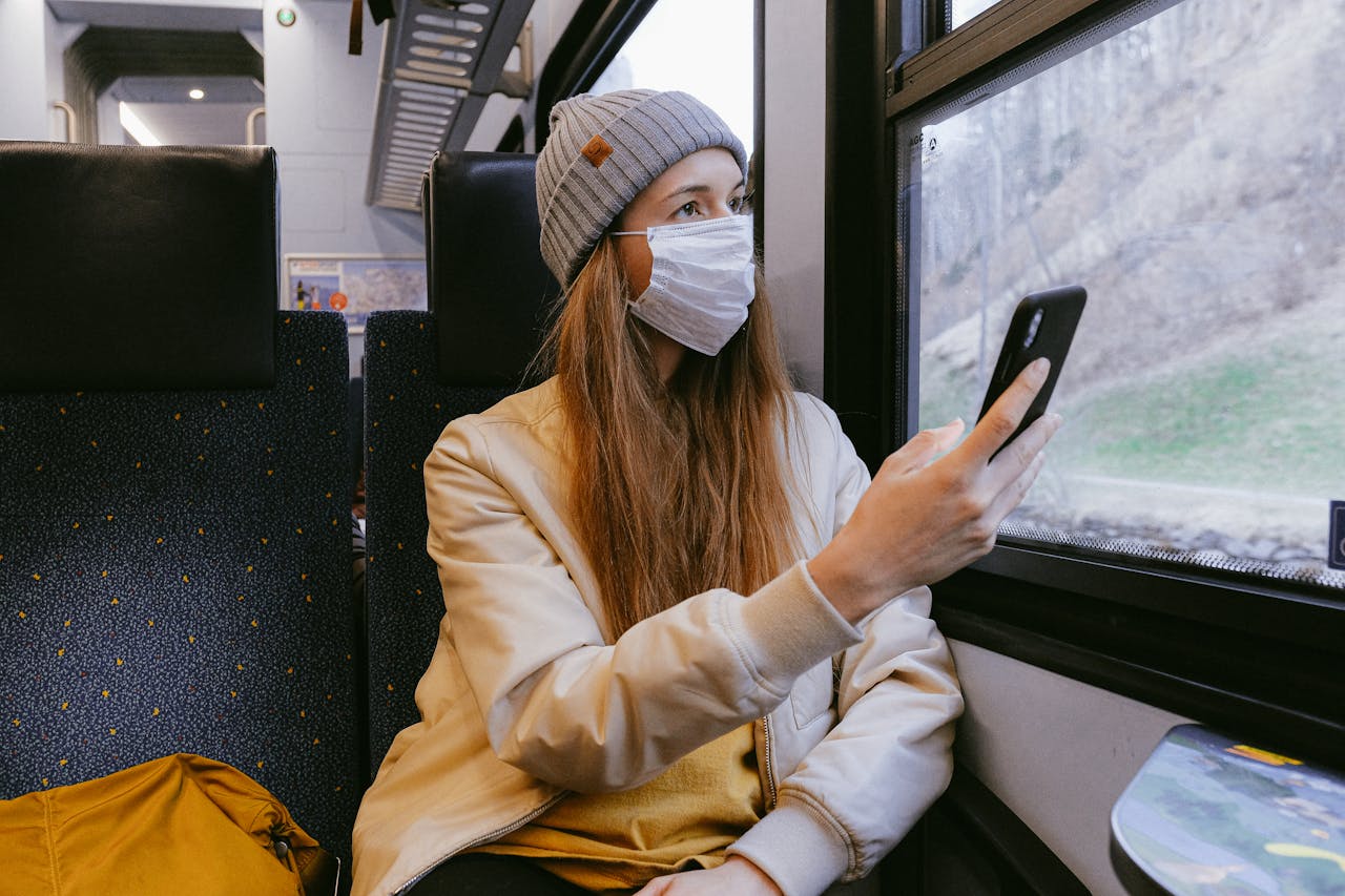 Traveler holding insurance papers and first aid kit, emphasizing the importance of travel protection.
