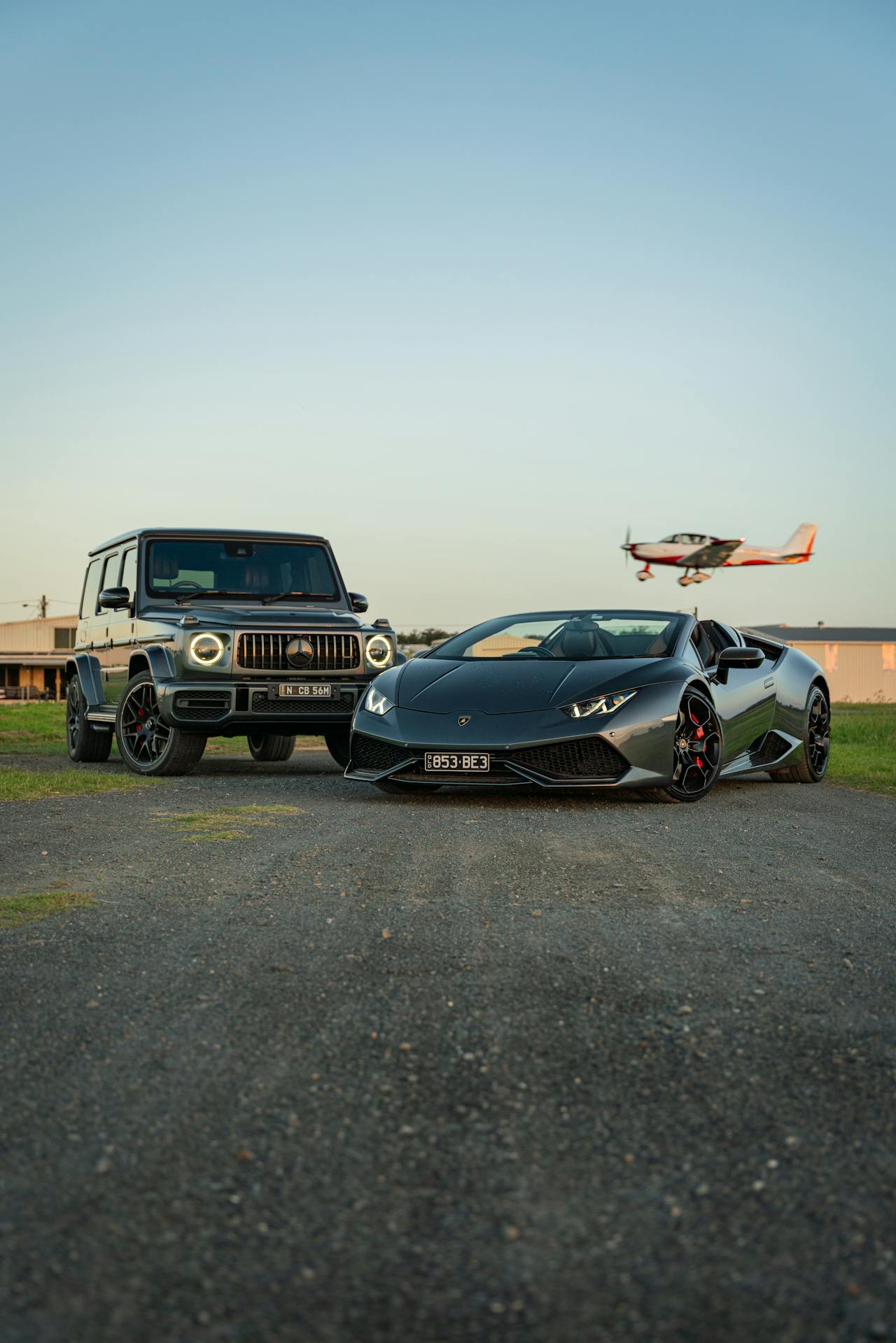 Car driving on a highway beside a plane flying in the sky, showing cost comparison between driving and flying.