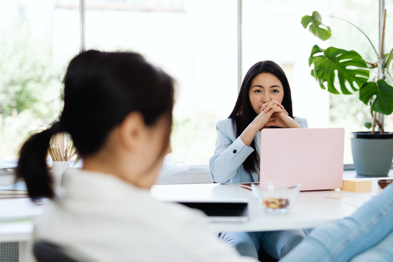 Candidate leaning far back in the chair or leaning too close to the interviewer, creating discomfort.