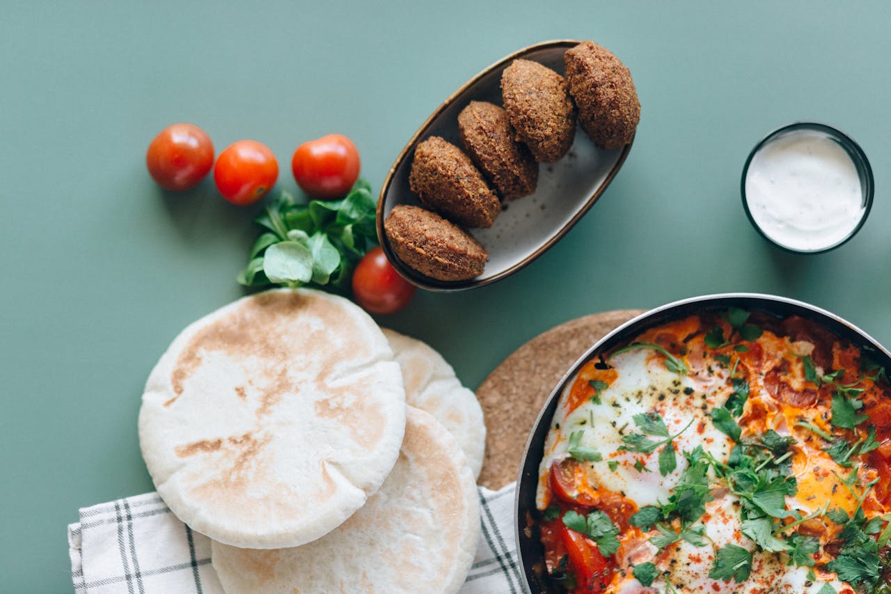 Hotdish topped with golden melted cheese and crispy breadcrumbs, styled with fresh herbs for a photogenic presentation.
