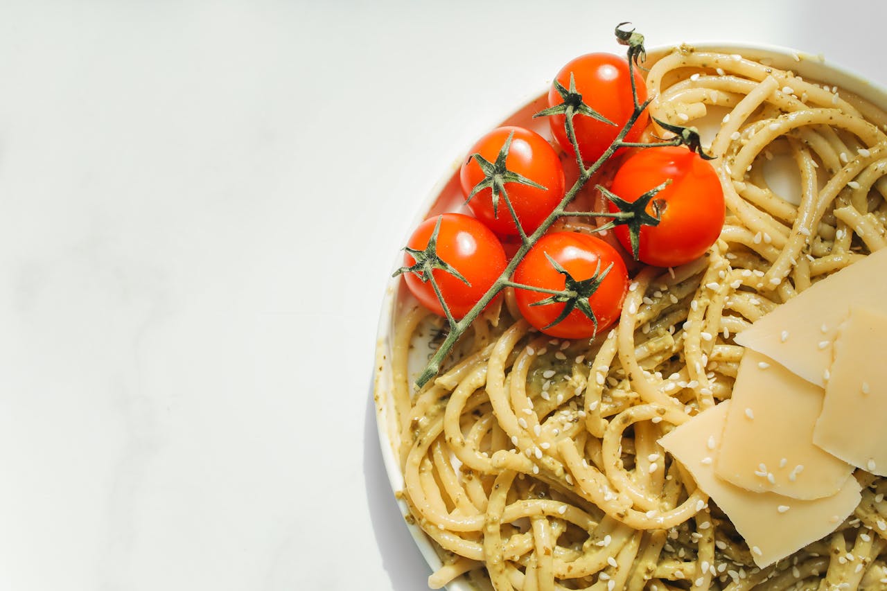 Hotdish with layers of noodles, vegetables, and protein, showing customizable ingredients and colorful presentation.