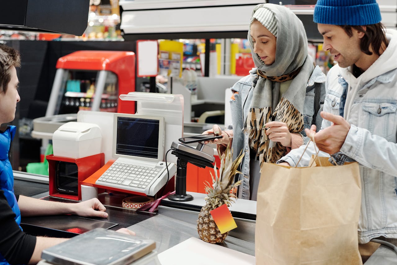 Customer with too many items in the express checkout line at a supermarket