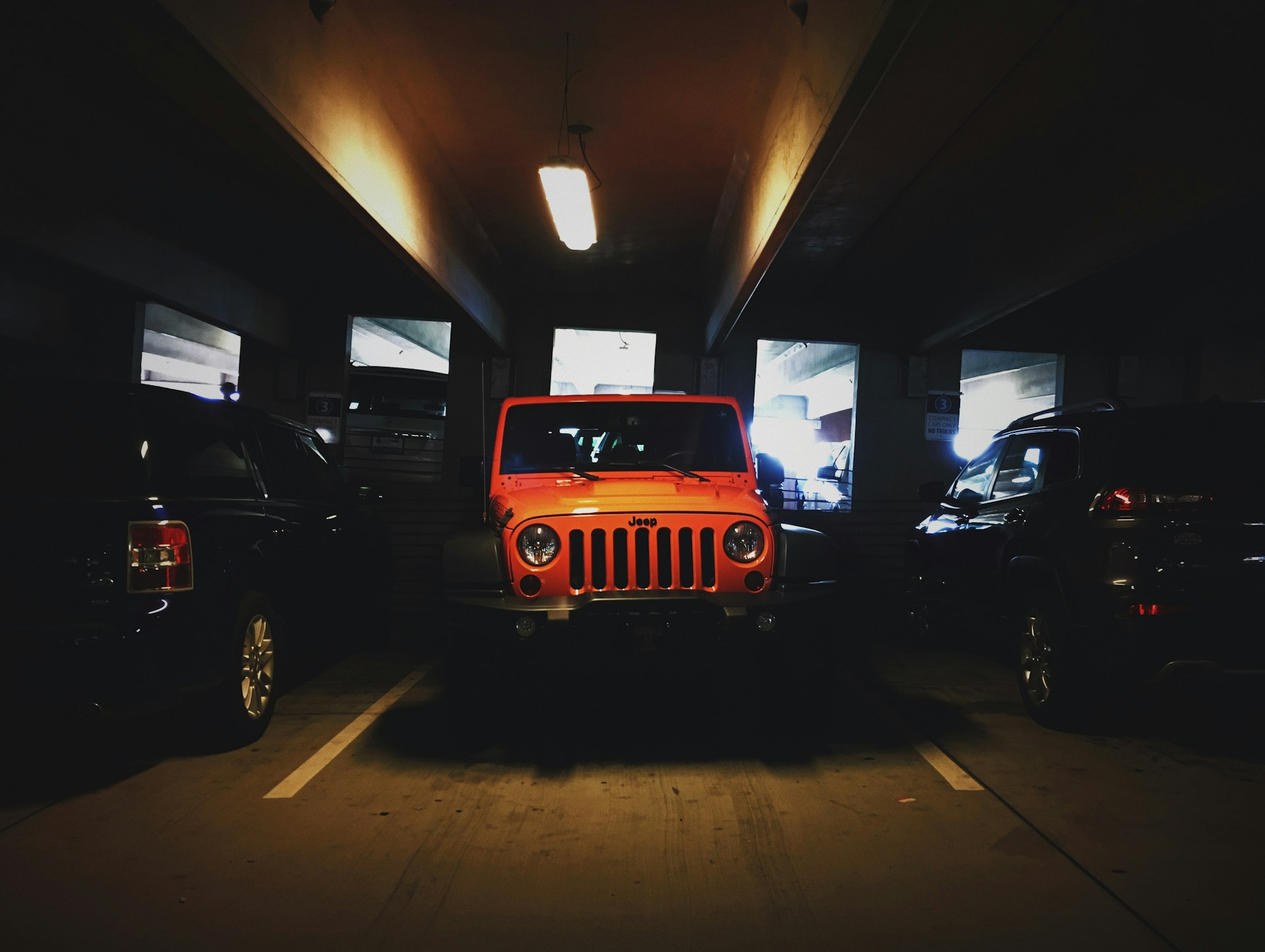 Residential garage with a parked SUV and nearby household items highlighting potential fire hazards