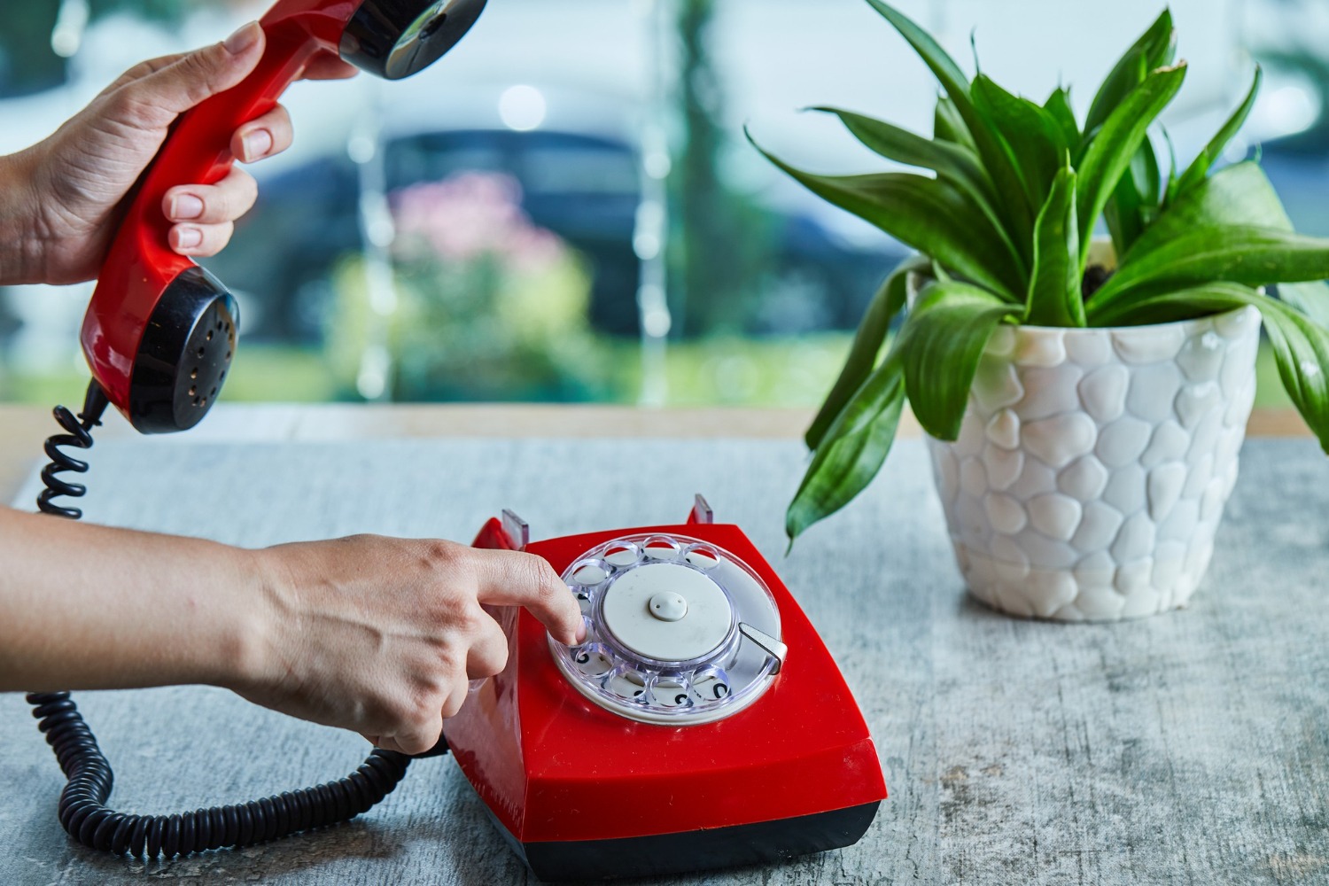 Rotary phone receiver with cord, symbolizing the loud click of someone joining the line.