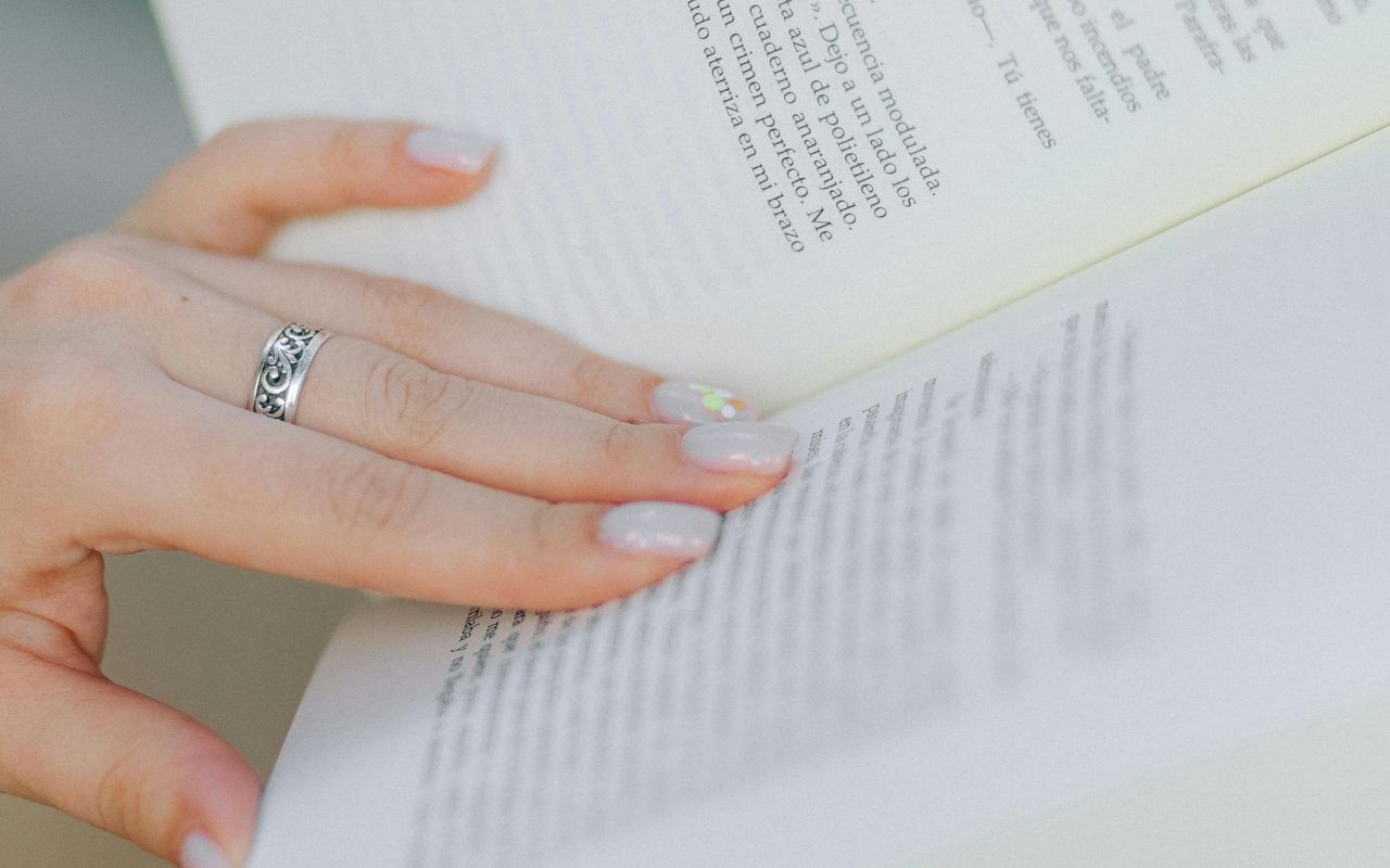 . Layered Delicate Rings That Suggest Artistic Flair