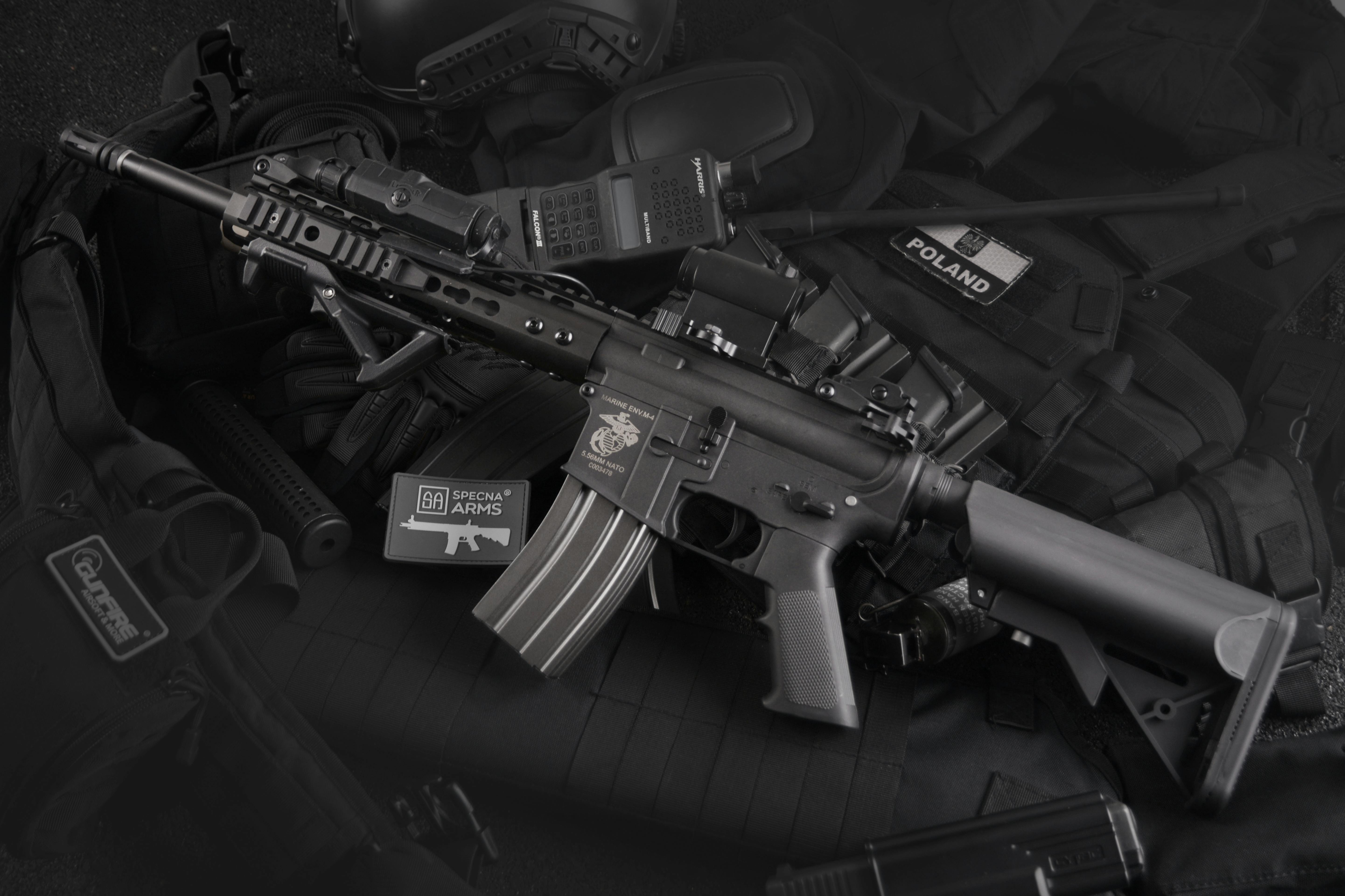 Used firearm displayed next to boxed new firearm at gun show